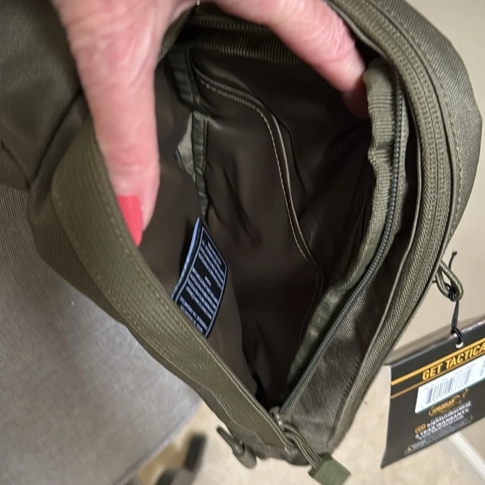 Tactical Sling Bag - Olive Green. Multiple pockets. Spacious compartments.